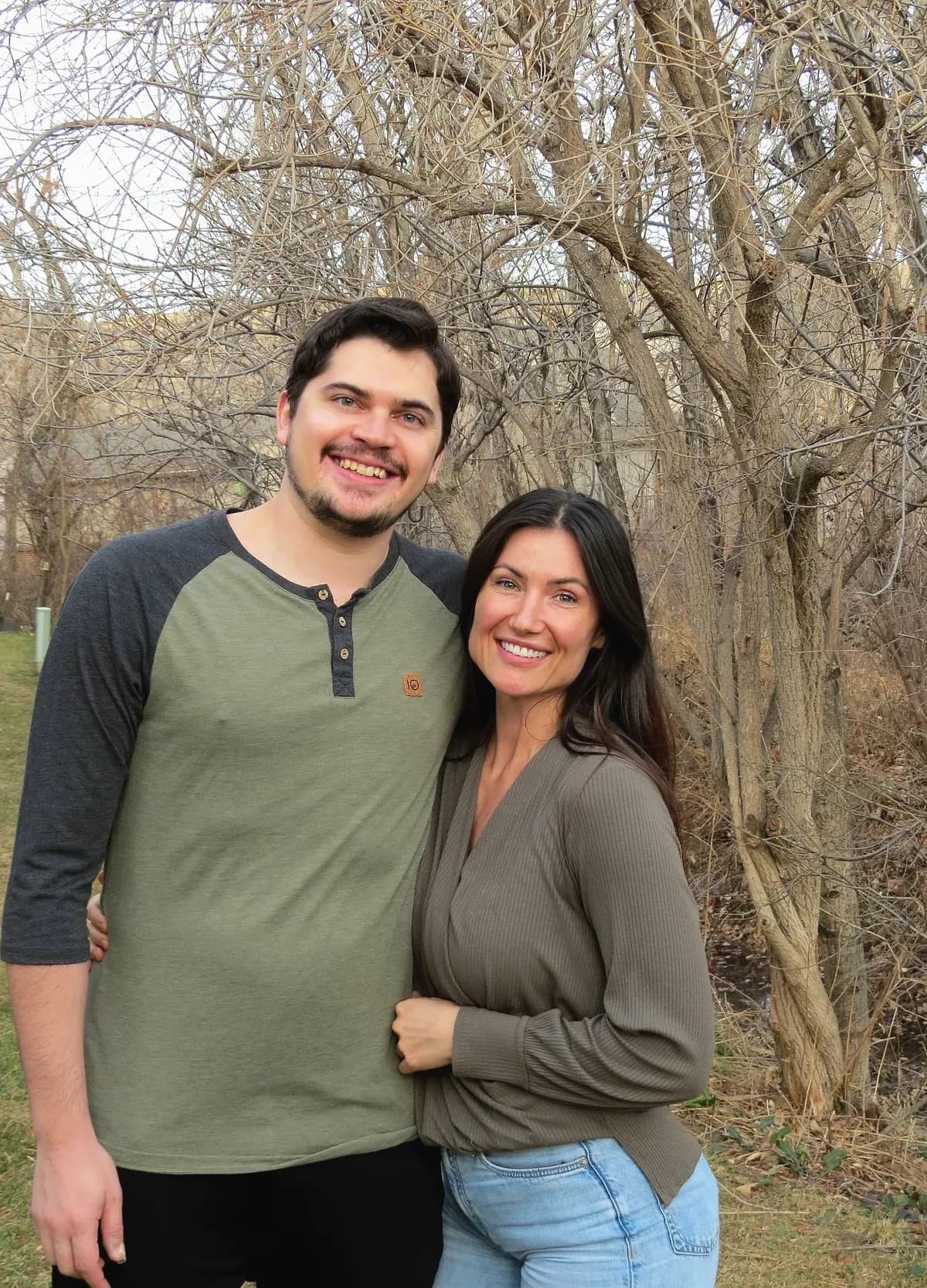 Anna and Brandon standing together outdoors, smiling